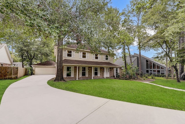 view of front of home featuring a garage and a front yard