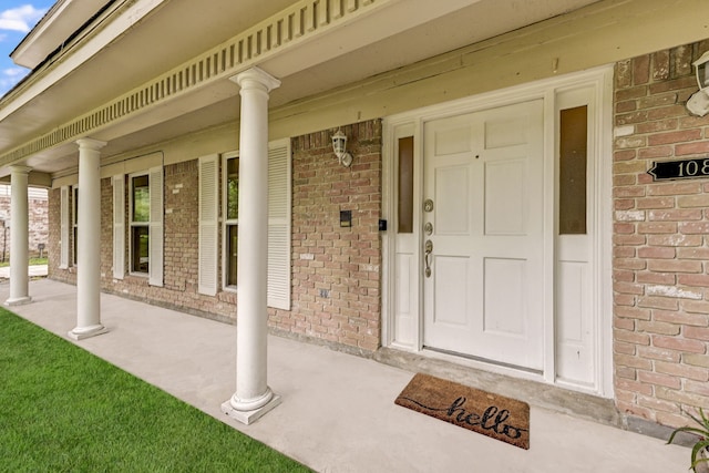 entrance to property with a porch