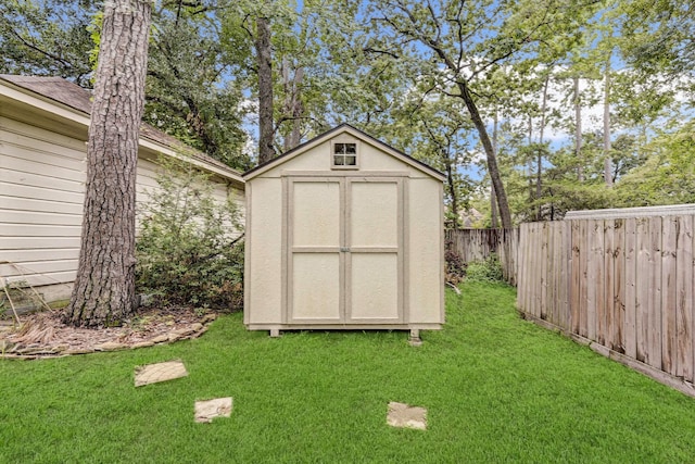 view of outbuilding featuring a lawn