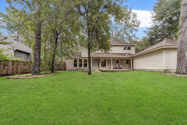 back of property featuring a lawn