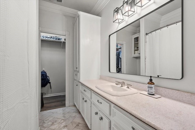 9819 Crestwater Cir, Magnolia, TX 77354 - full bathroom featuring marble finish flooring, vanity, a spacious closet, and crown molding