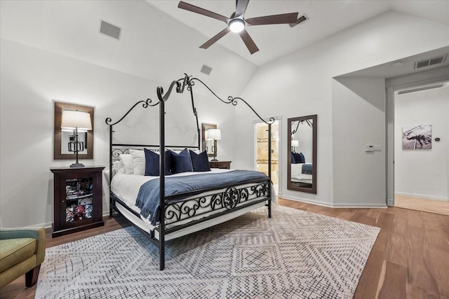 bedroom featuring lofted ceiling, wood-type flooring, and ceiling fan