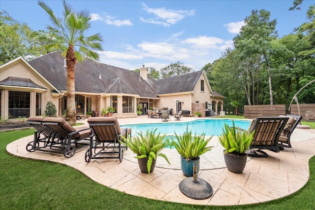 view of swimming pool with a patio