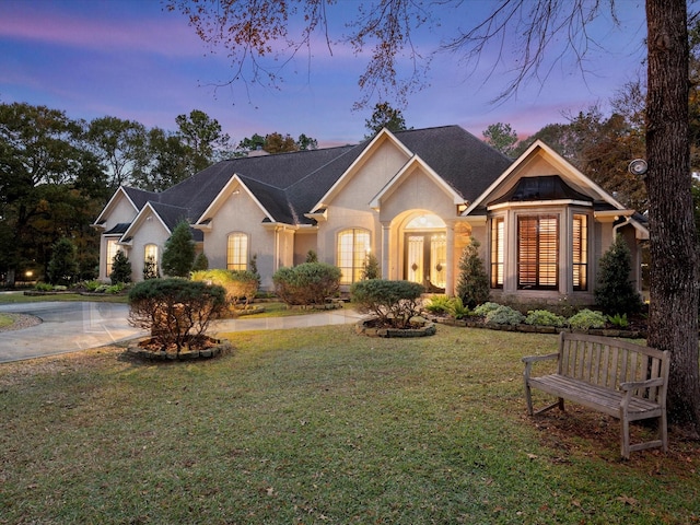 ranch-style house with a lawn