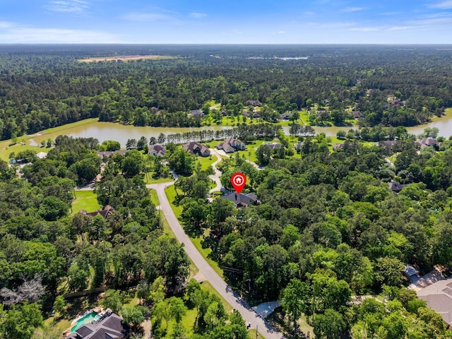 9819 Crestwater Cir, Magnolia, TX 77354 - drone / aerial view of a heavily wooded area and a large body of water