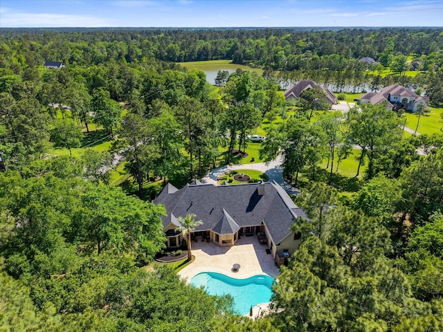 9819 Crestwater Cir, Magnolia, TX 77354 - bird's eye view of a heavily wooded area, a large body of water, and a pool