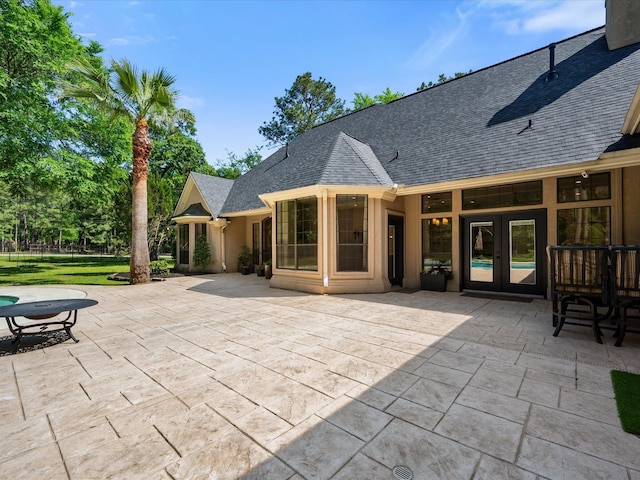 9819 Crestwater Cir, Magnolia, TX 77354 - view of patio featuring french doors