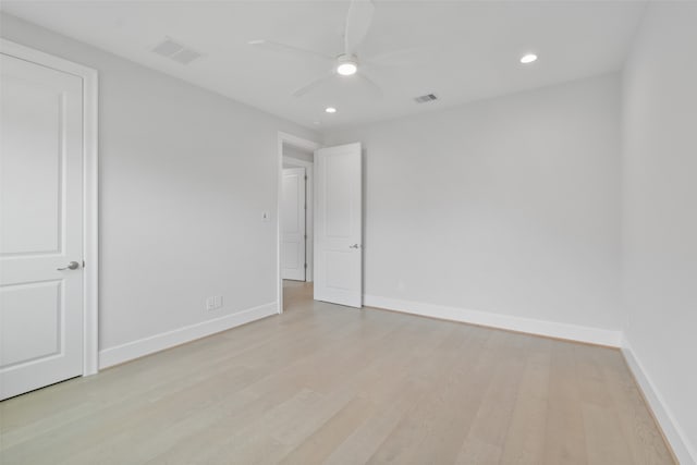 spare room featuring ceiling fan and light hardwood / wood-style floors