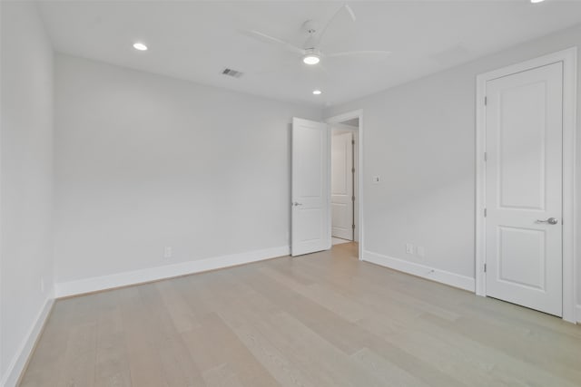 unfurnished room featuring ceiling fan and light wood-type flooring