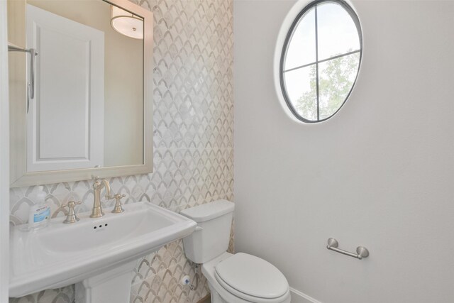 bathroom with toilet and sink