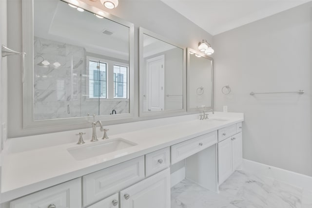 bathroom featuring double vanity, a tile shower, and tile patterned flooring