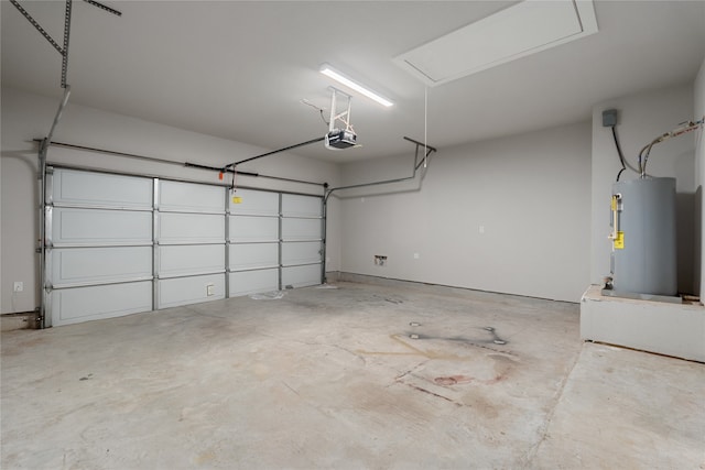 garage with electric water heater and a garage door opener