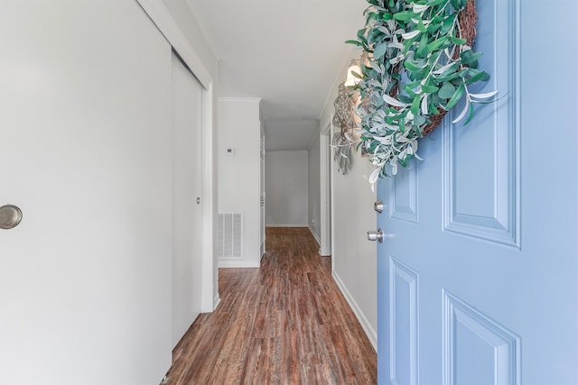 hall with dark hardwood / wood-style flooring