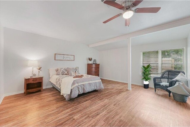 bedroom with ceiling fan and light hardwood / wood-style flooring