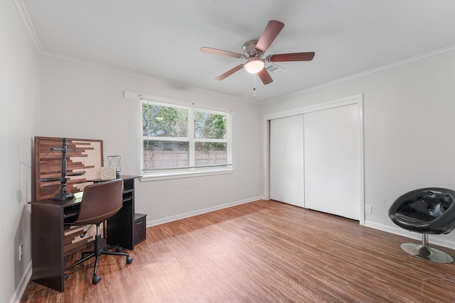 office space featuring hardwood / wood-style flooring, ornamental molding, and ceiling fan