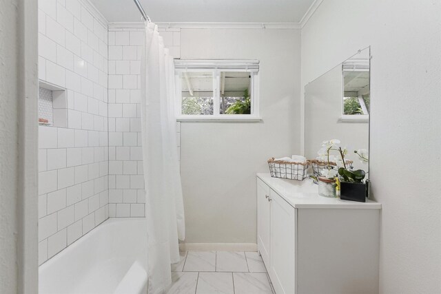 bathroom with tile patterned floors, shower / bathtub combination with curtain, vanity, and ornamental molding