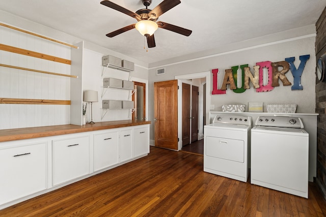 laundry area featuring a wall mounted air conditioner, cabinets, ceiling fan, dark wood-type flooring, and washer and clothes dryer