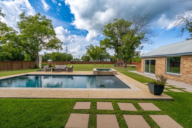 view of pool with an in ground hot tub, a yard, outdoor lounge area, and a playground