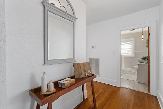 hallway featuring hardwood / wood-style floors