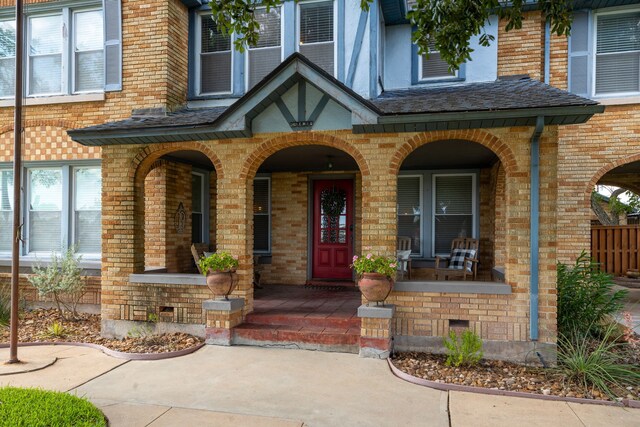 doorway to property with covered porch