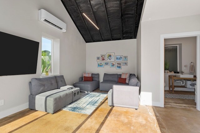 living room featuring a wall mounted air conditioner, vaulted ceiling, and concrete floors