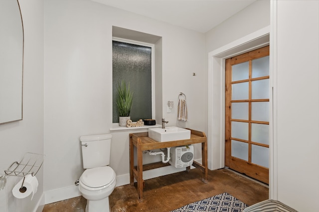 bathroom with toilet and sink