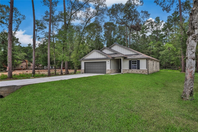 view of front of property with a garage and a front lawn