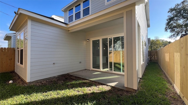 back of property with a patio