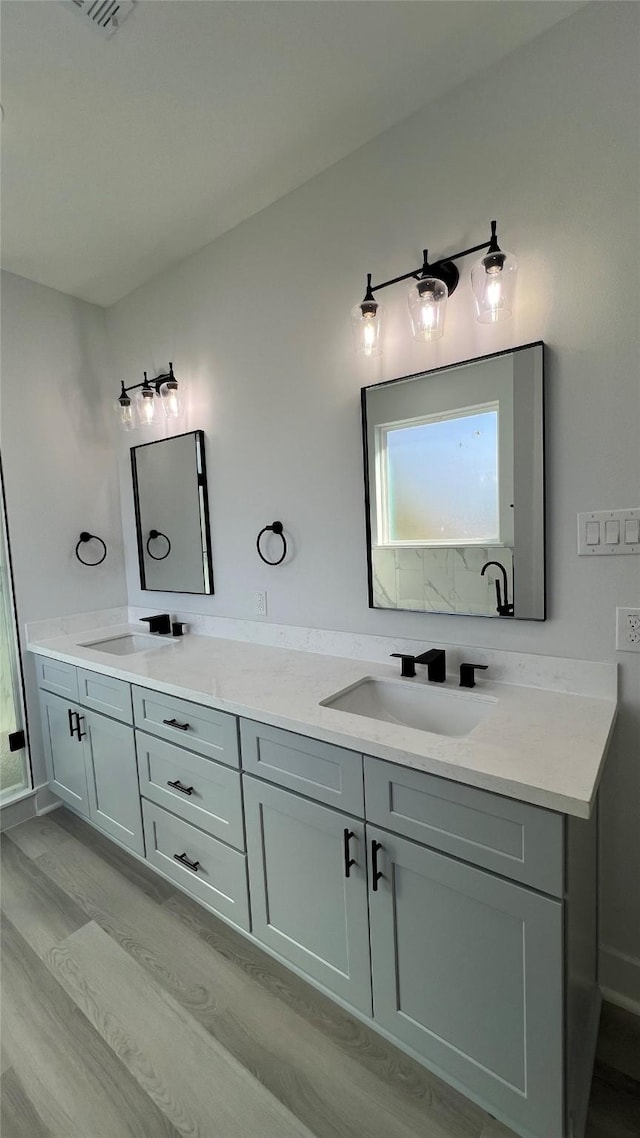 bathroom featuring hardwood / wood-style floors and vanity