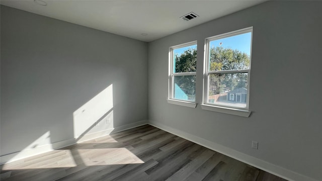 spare room featuring hardwood / wood-style flooring