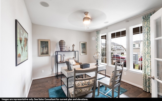 dining space featuring dark wood-type flooring and ceiling fan