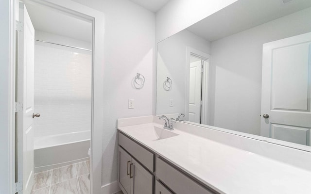 full bath featuring toilet, washtub / shower combination, and vanity