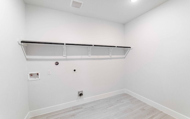 laundry area featuring gas dryer hookup, hookup for a washing machine, laundry area, visible vents, and electric dryer hookup