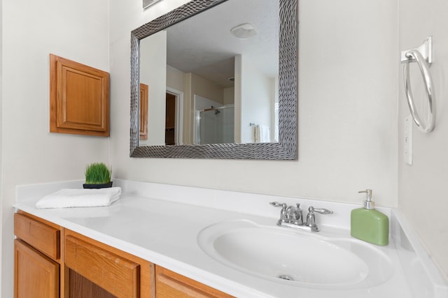 bathroom featuring vanity and walk in shower