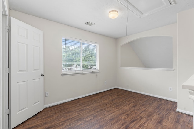 empty room with dark hardwood / wood-style floors