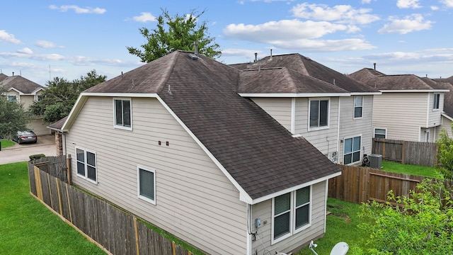 view of home's exterior featuring a yard and cooling unit