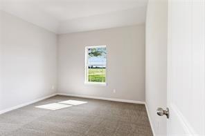 empty room featuring carpet flooring