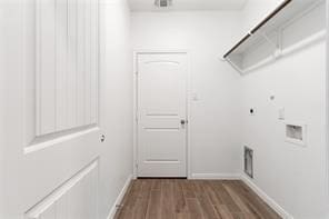 laundry room with hardwood / wood-style flooring, electric dryer hookup, washer hookup, and hookup for a gas dryer