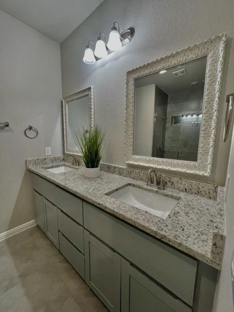 bathroom with vanity and a shower with shower door