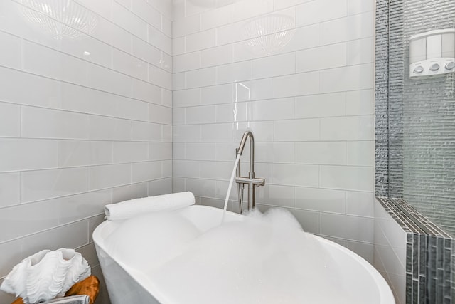 bathroom with tile walls