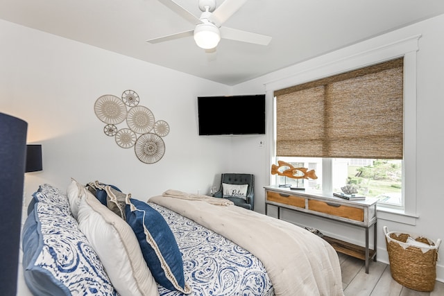 bedroom with light hardwood / wood-style flooring and ceiling fan