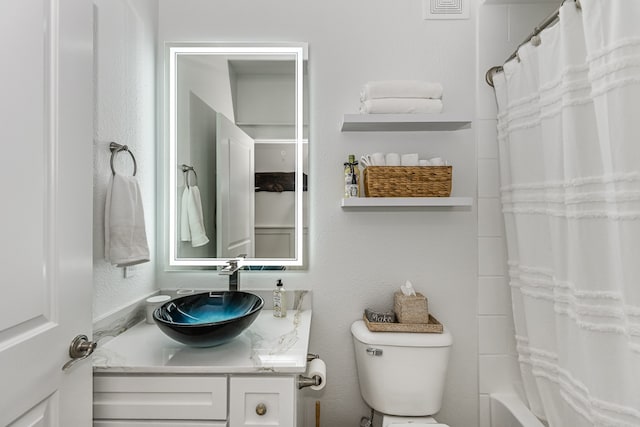 full bathroom with vanity, toilet, and shower / bath combination with curtain