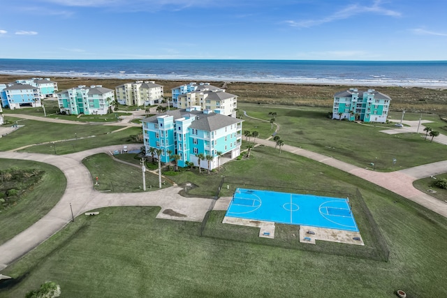 aerial view with a water view and a beach view