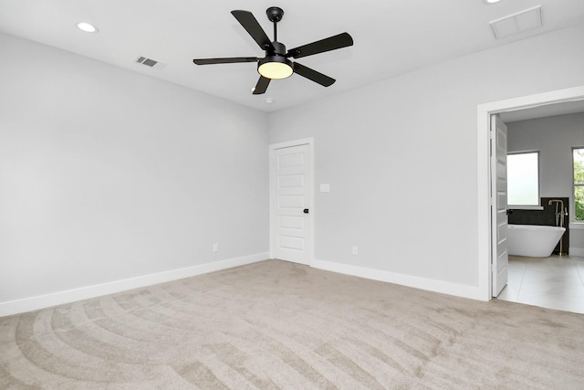 carpeted empty room with ceiling fan