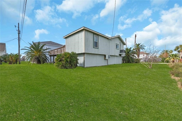 view of side of property with a lawn