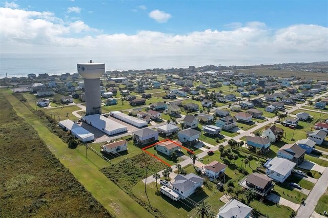 bird's eye view featuring a residential view and a water view