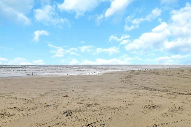 property view of water featuring a beach view