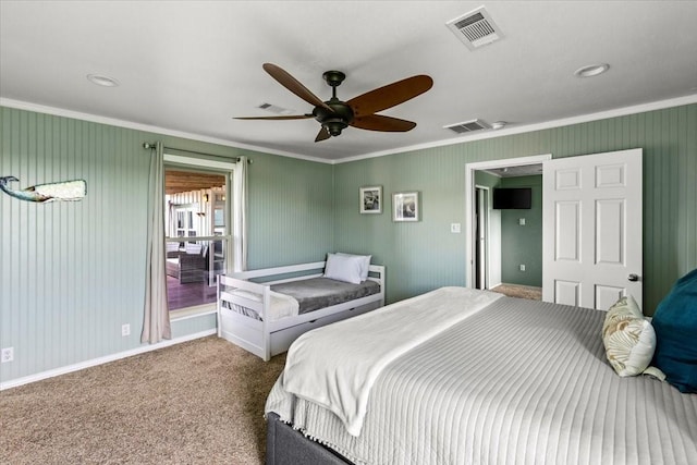 bedroom featuring carpet, visible vents, crown molding, and ceiling fan