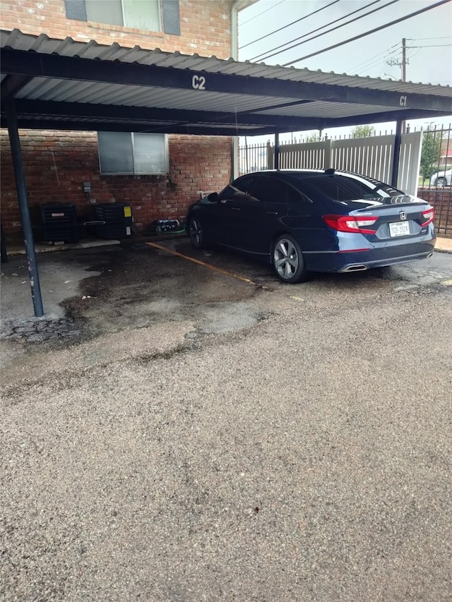 view of parking / parking lot with a carport