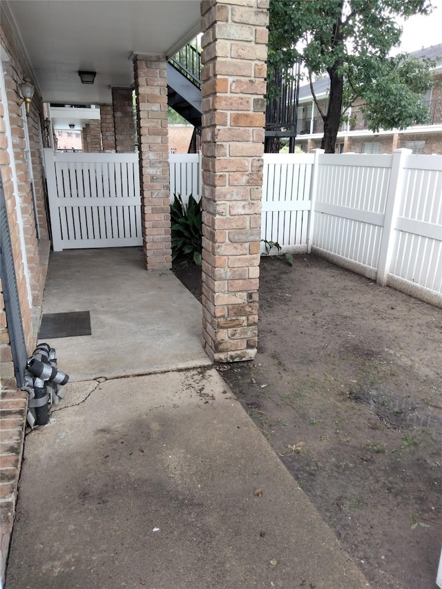 view of patio featuring fence